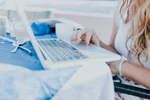 woman typing on a computer