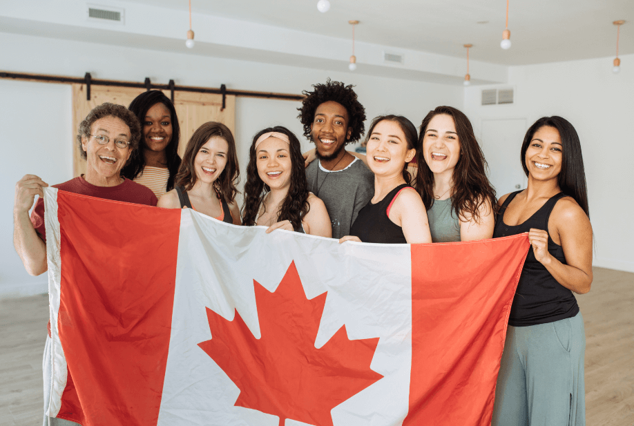 young canadians holding canadian flag