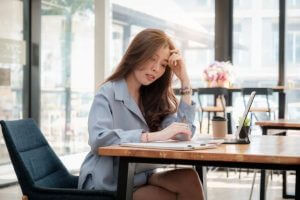 Young woman Using Calculator